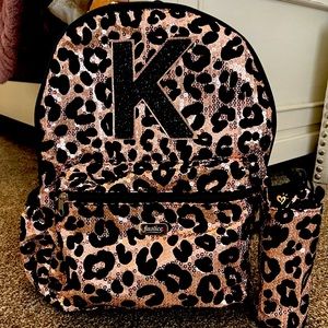 Justice “K” girls backpack with insulated water bottle holder.